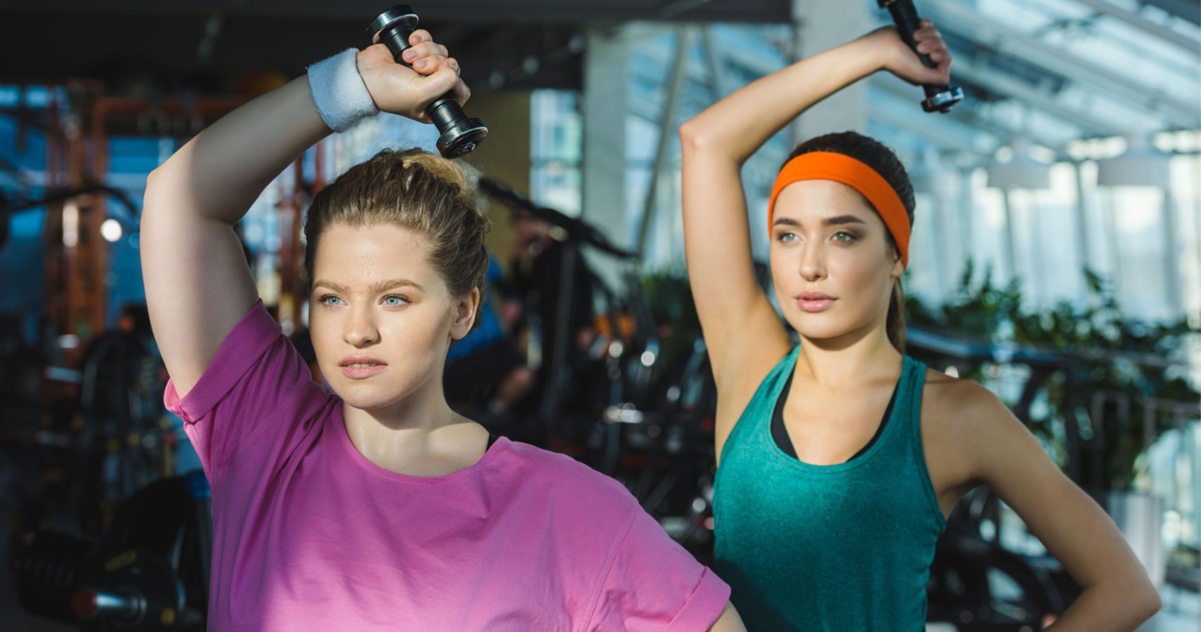 two women working out at gym