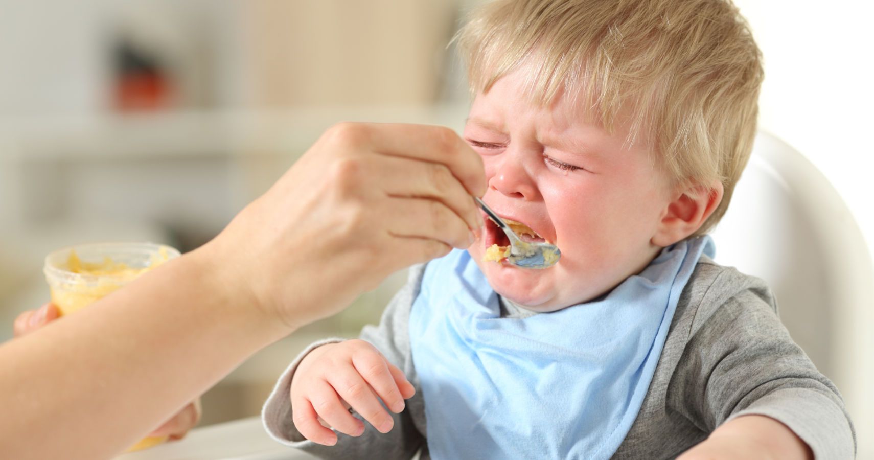 child crying while eating