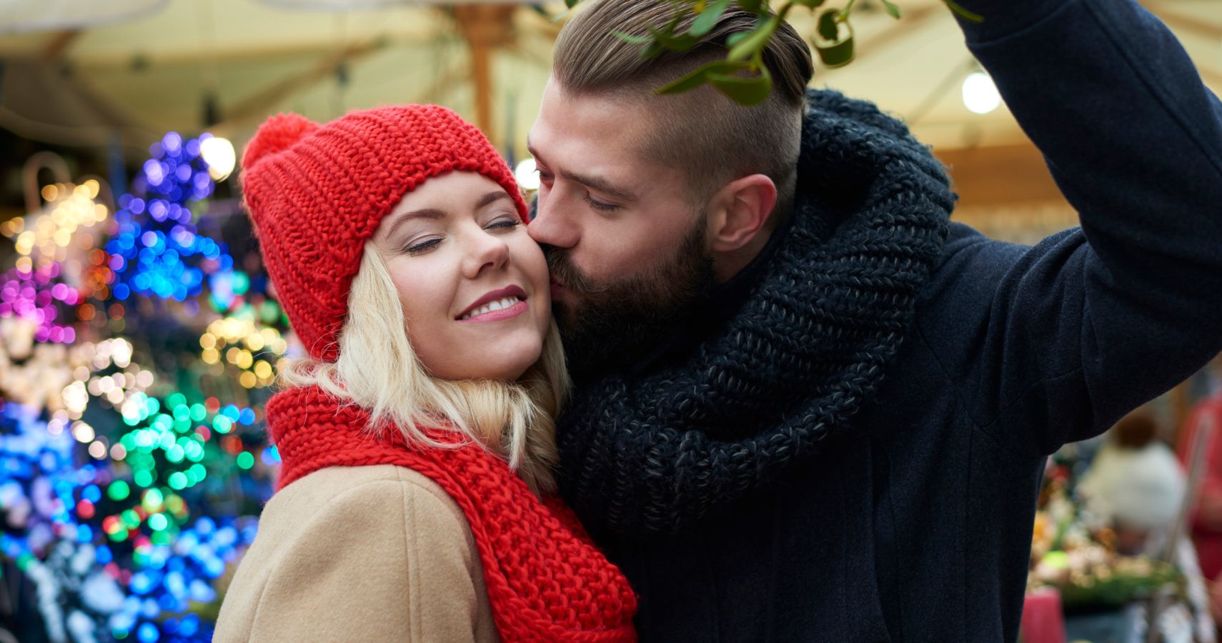 couple kissing mistletoe