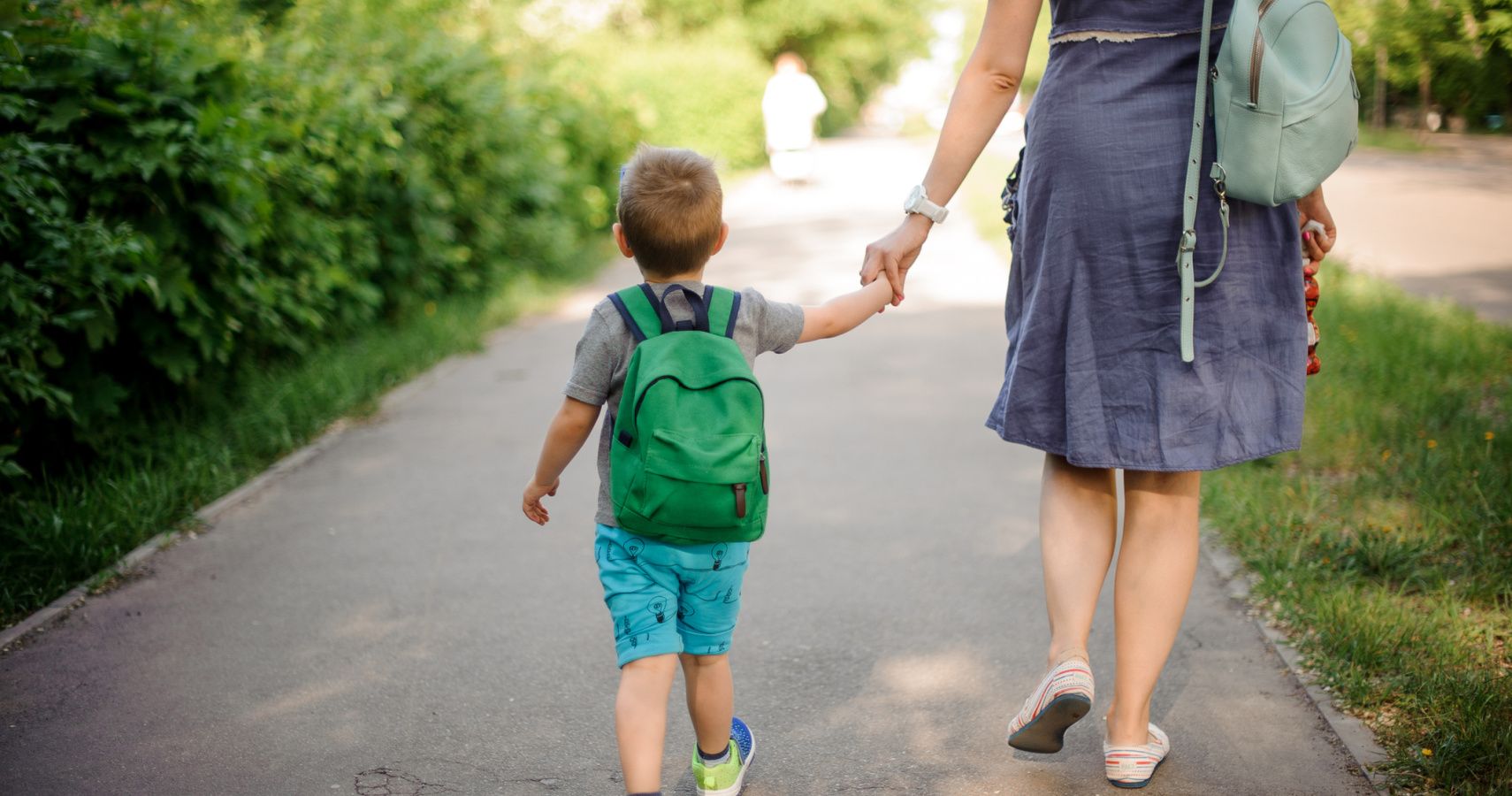 mom walking son to school