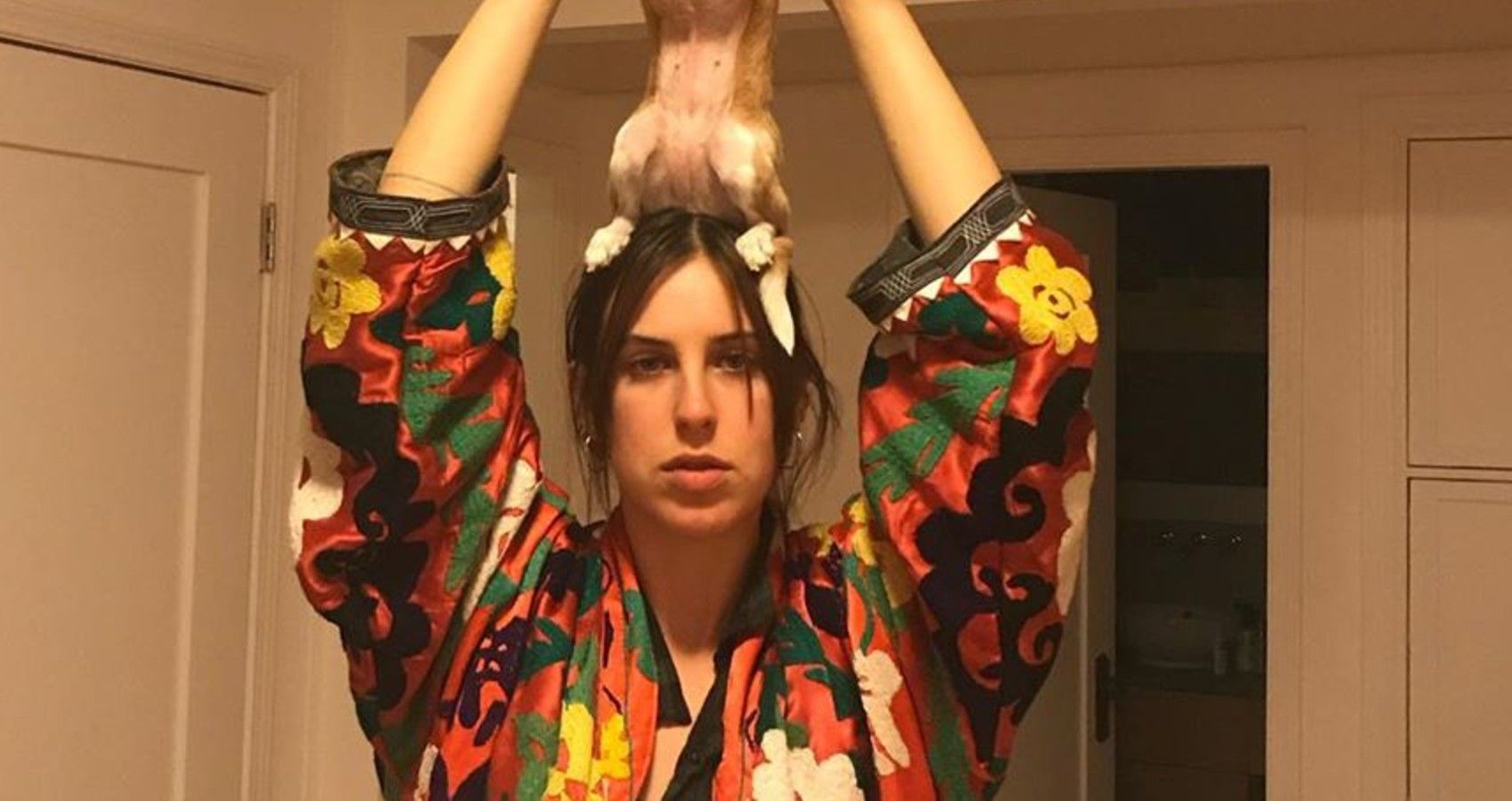 Tallulah Holding A Dog Above Her Head