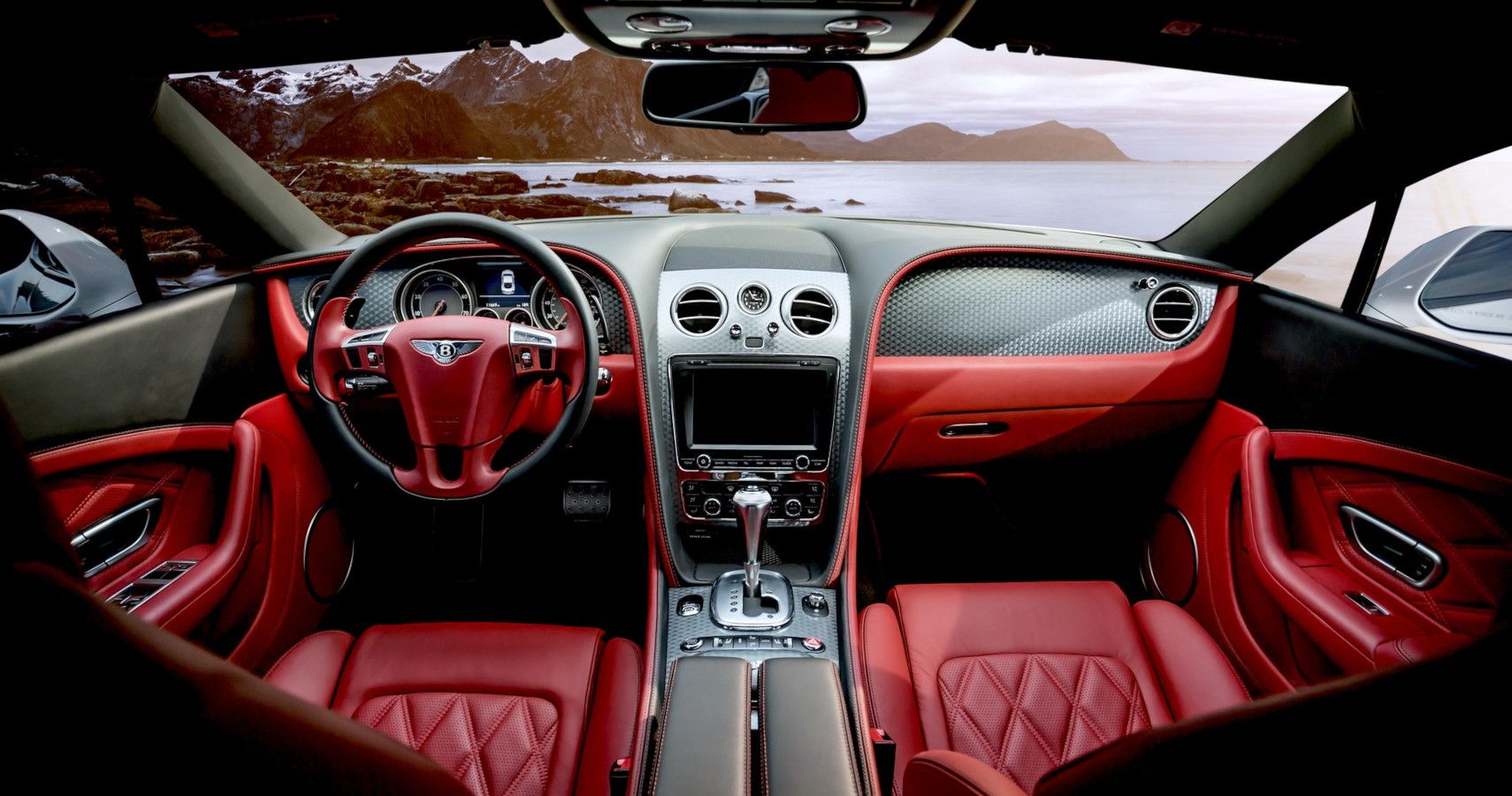 Inside a vehicle with red upholstery