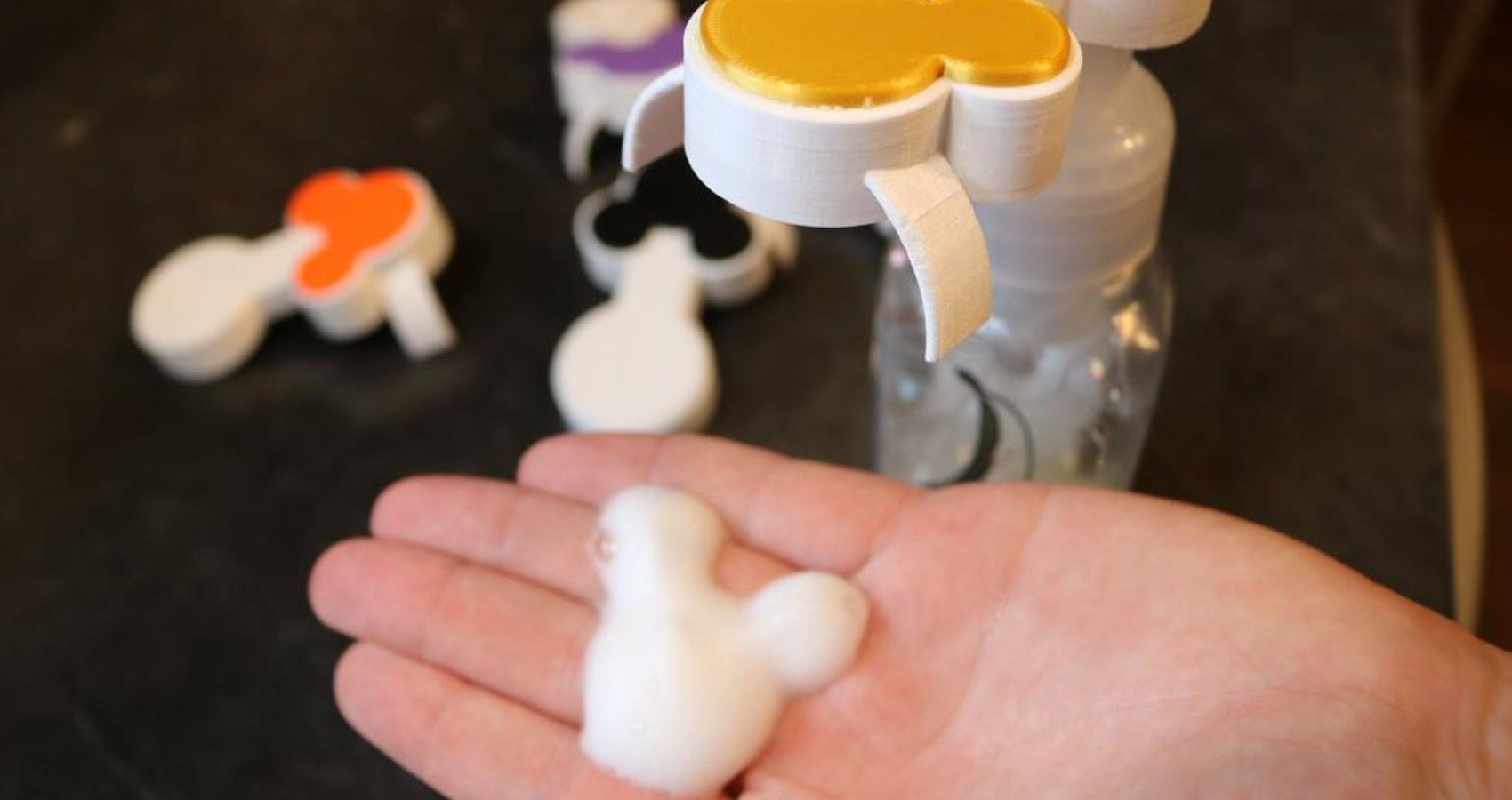 A soap dispenser that gives soap in the shape of Mickey Mouse