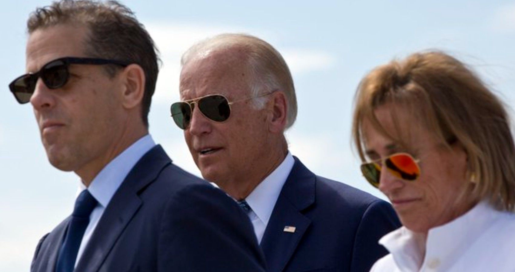 Joe Biden walking with his son and wife