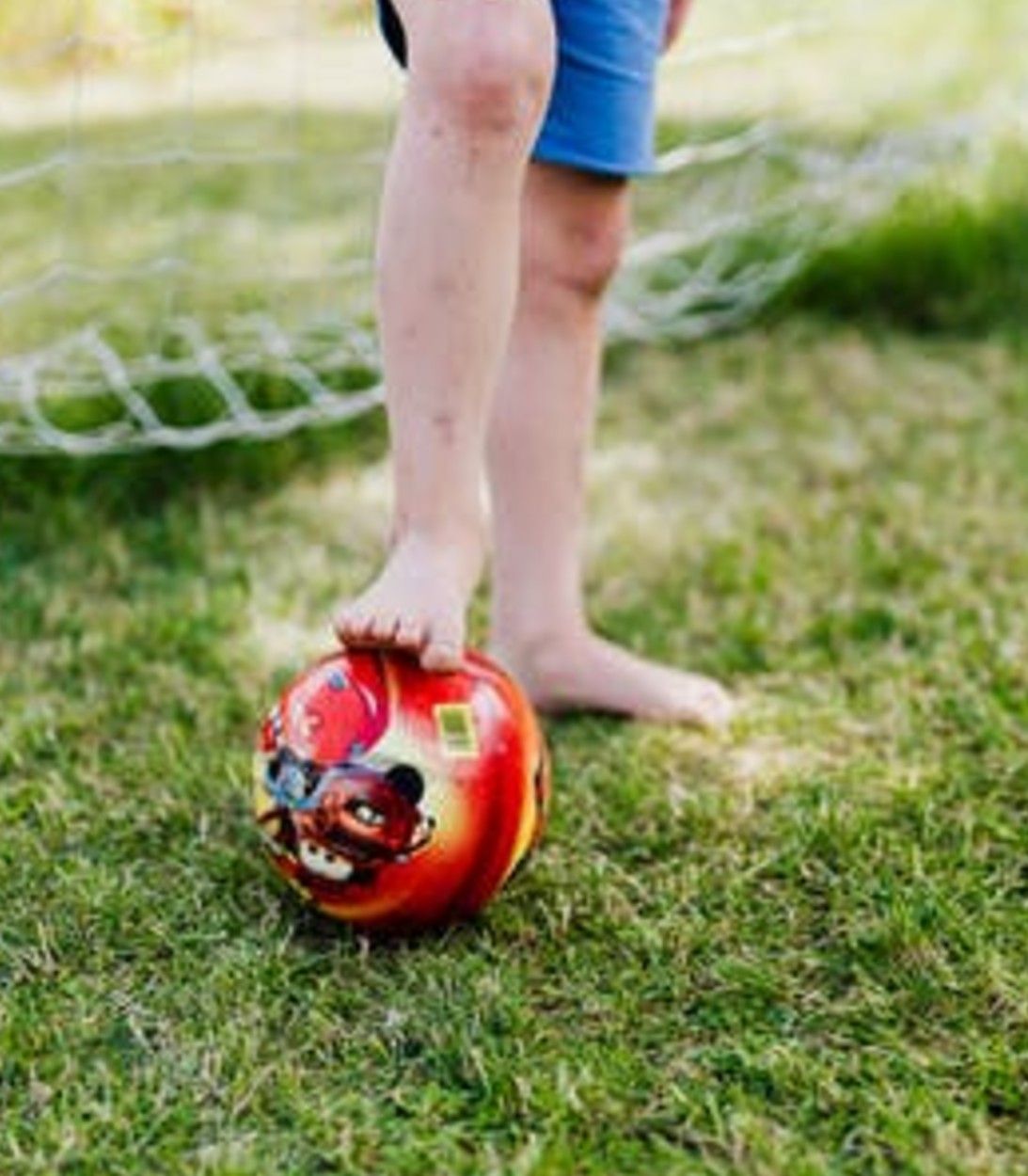 barefoot boy with ball
