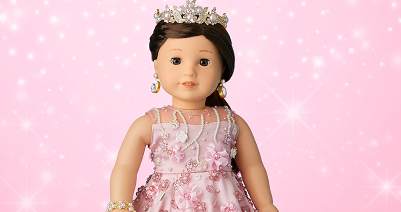 An American Girl doll with swarovski crystals all over it