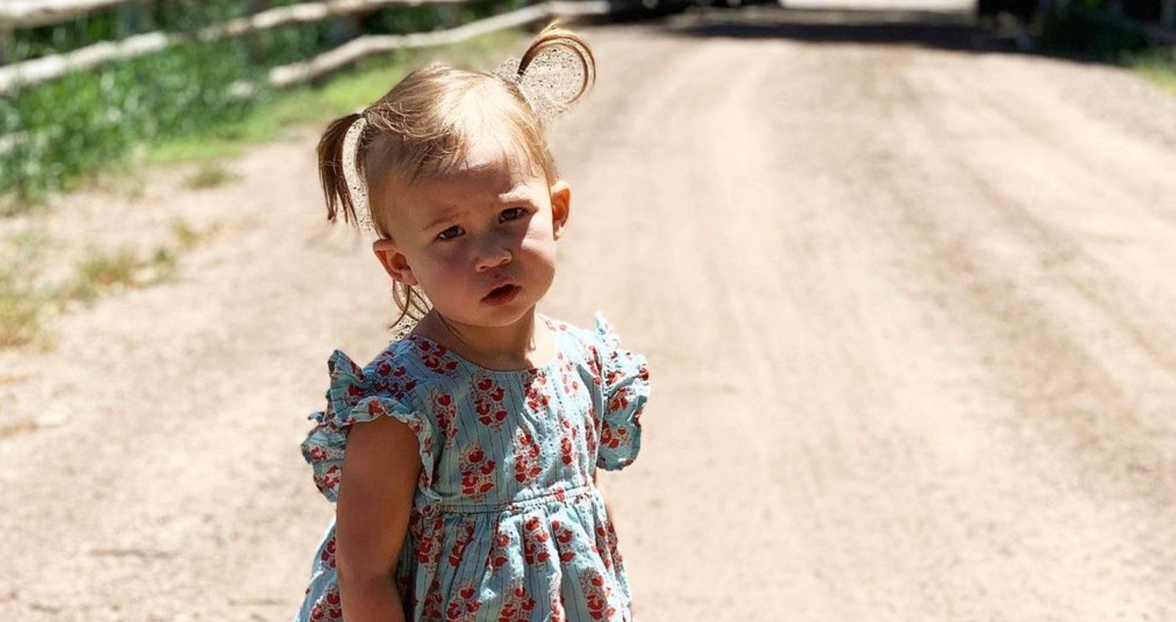 Kate Hudson's daughter standing outside with her hair in pigtails