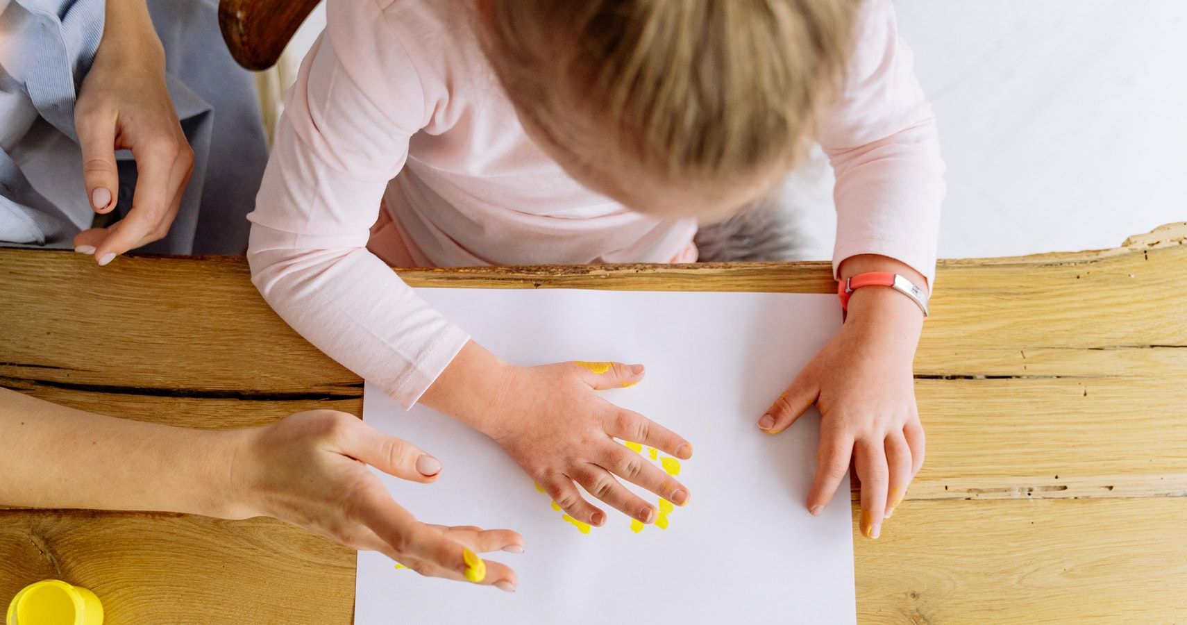 Young Girl Fingerprinting With Mom