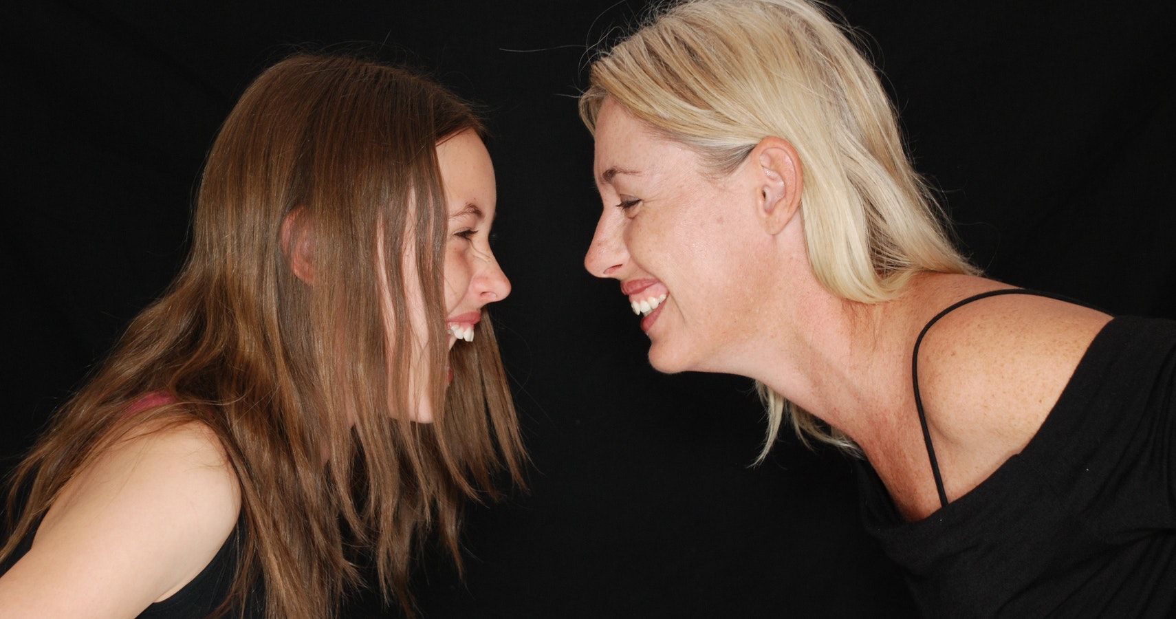 Mother and Daughter Laughing Together