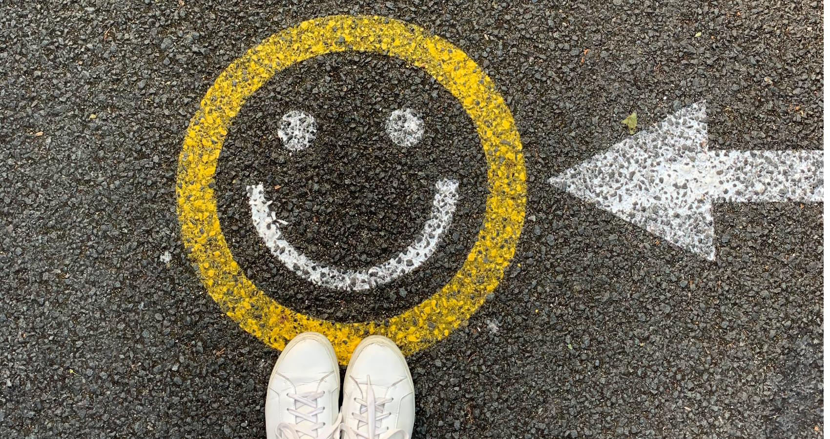 A smiley face painted on the road
