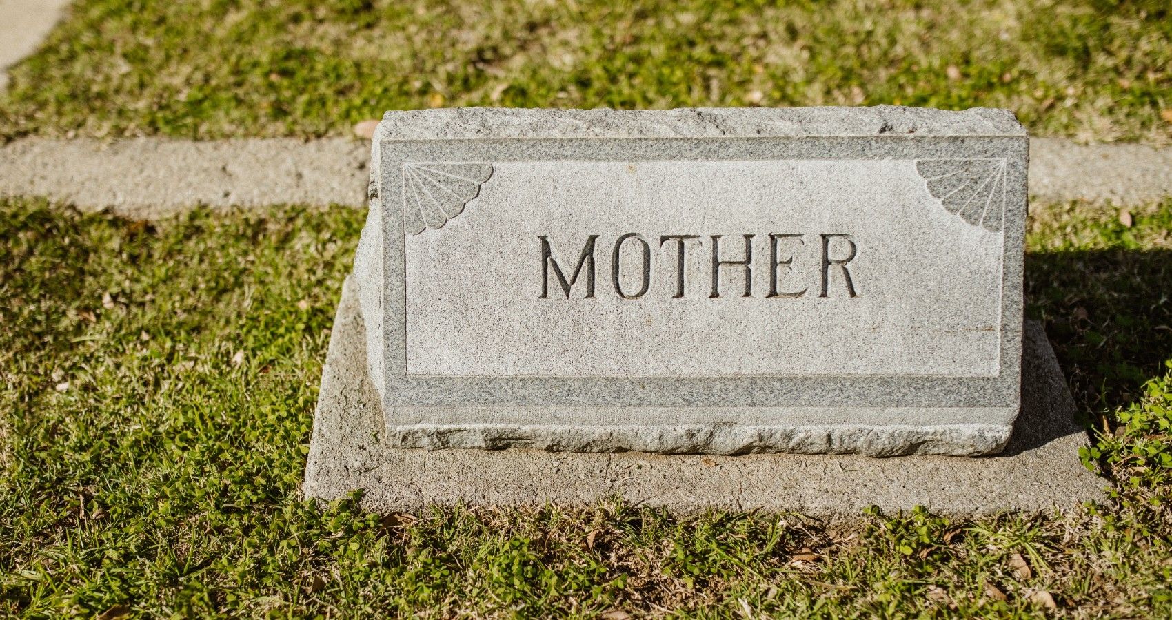 A gravestone that says mother on it in cemetary