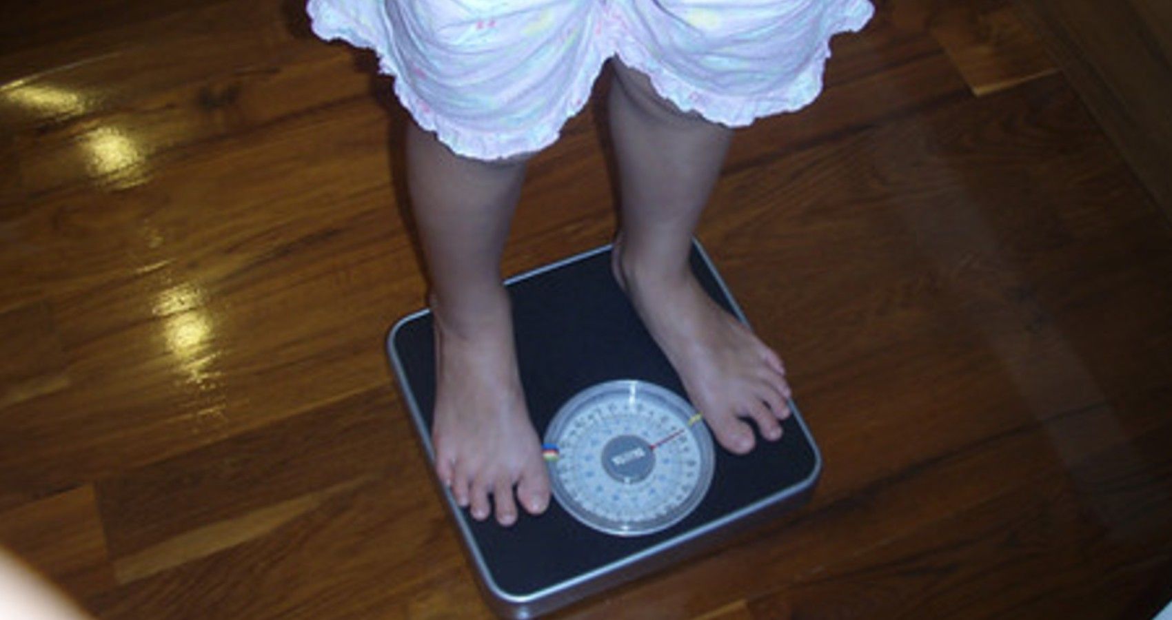 A child standing on a scale