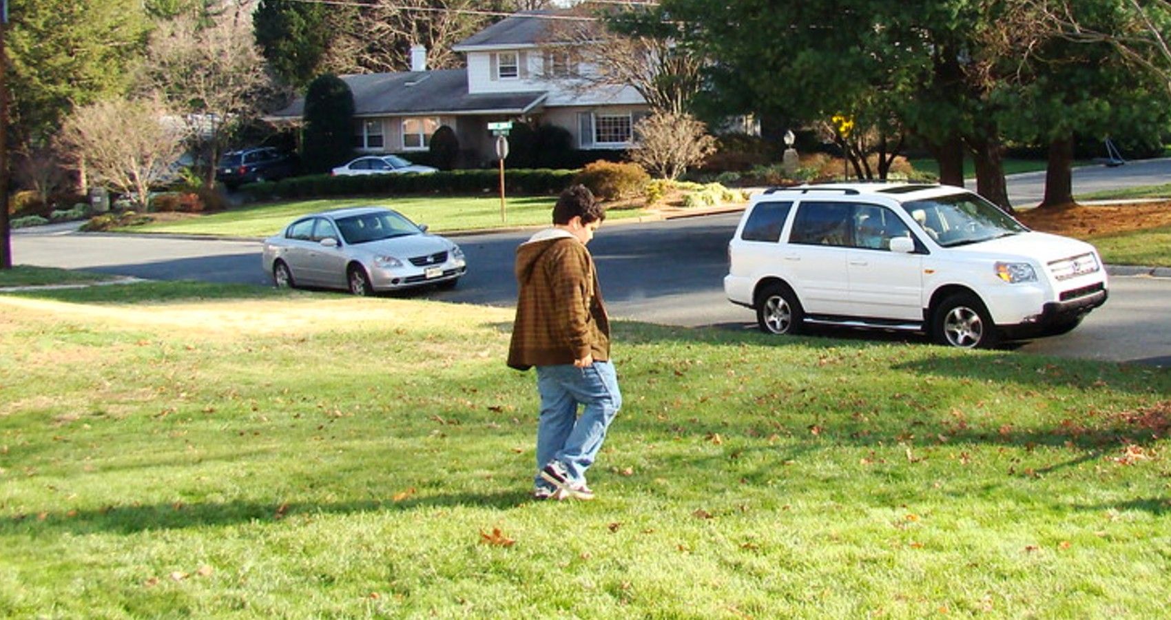A child just standing outside while playing