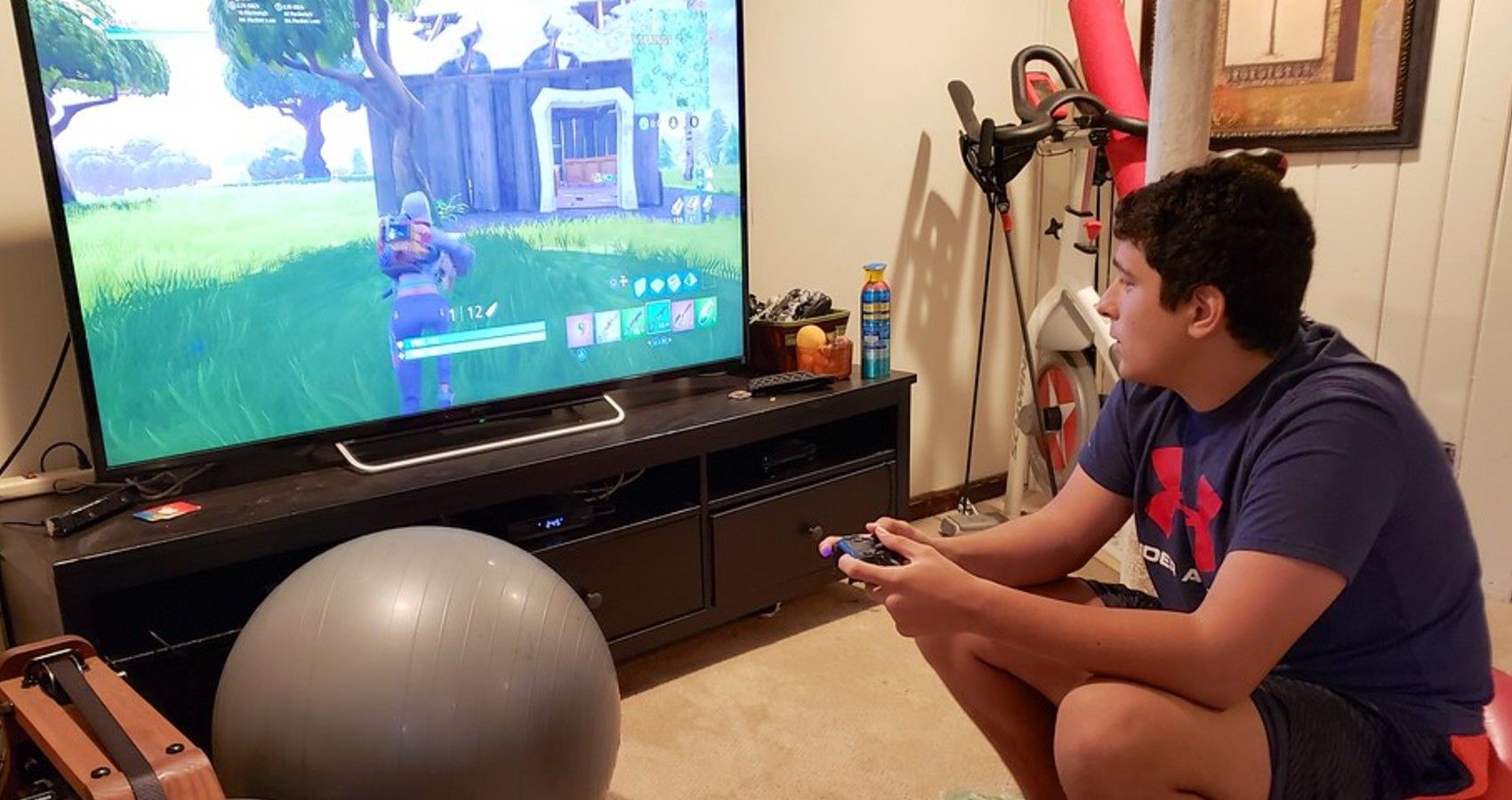 Fortnite Kids Have Prosocial Skills   A Child Sitting And Playing Fortnite 