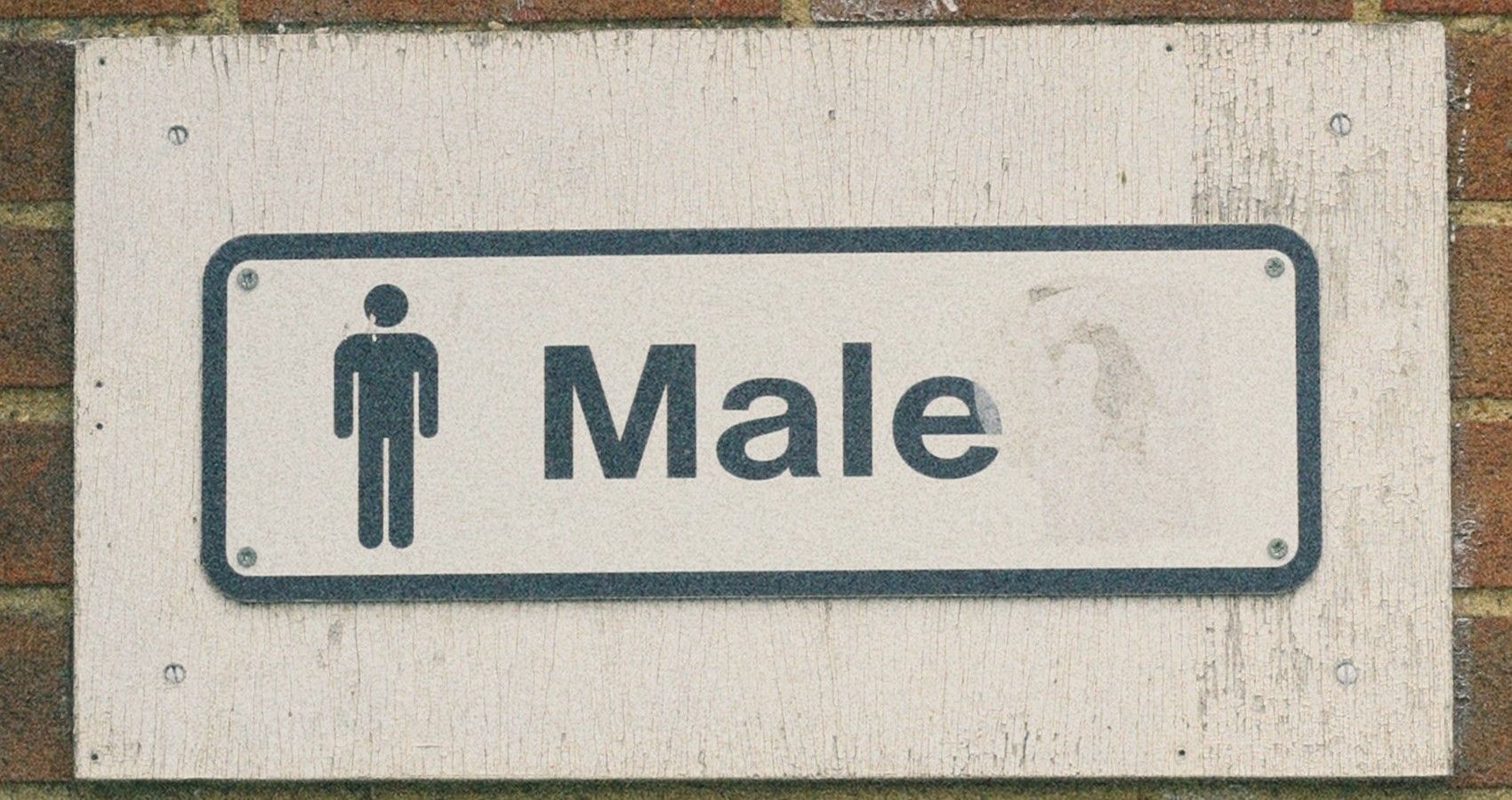 A sign for the male restroom