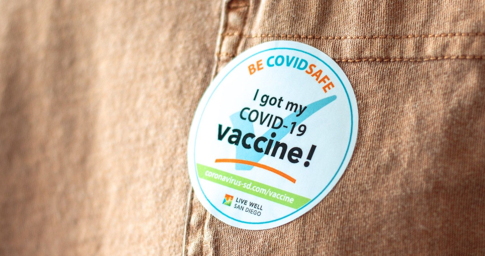 A sticker that says the person got their covid vaccine