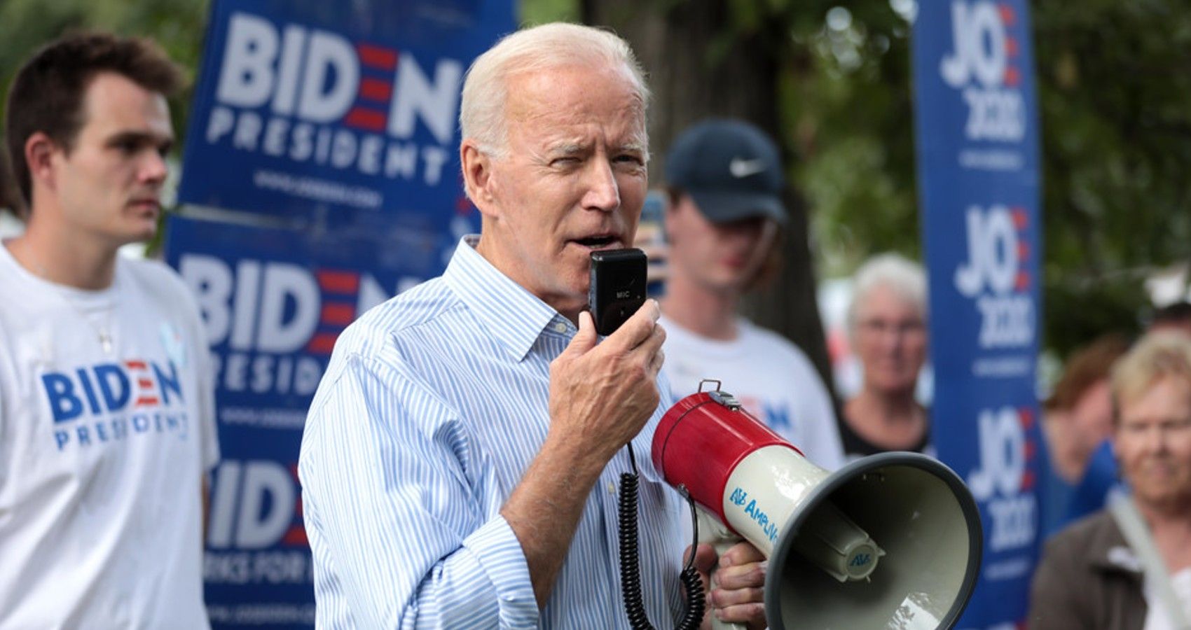 Joe Biden giving a speech with a megaphone