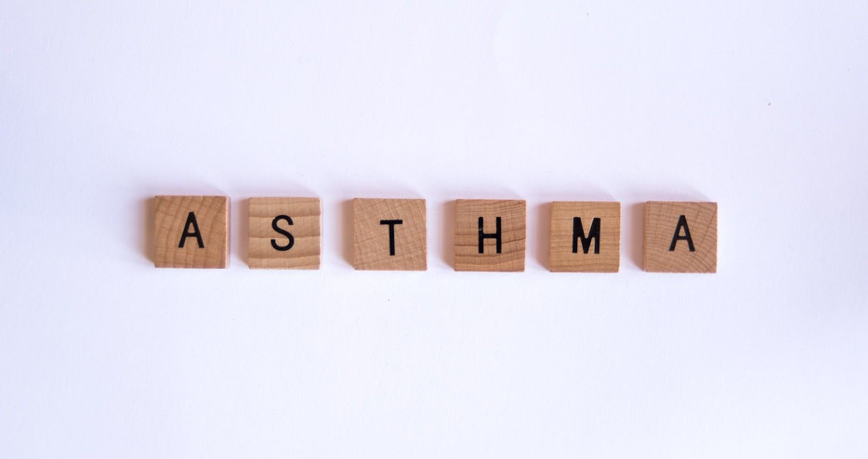 The word asthma spelt out with scrabble tiles