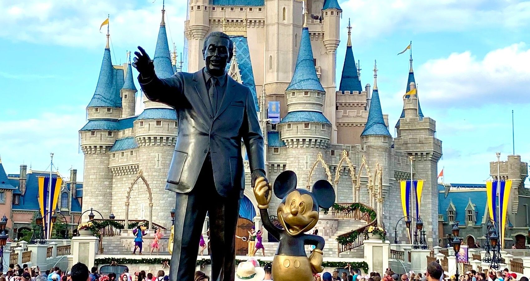 A Statue Of Walt Disney And Mickey Mouse At Disney World