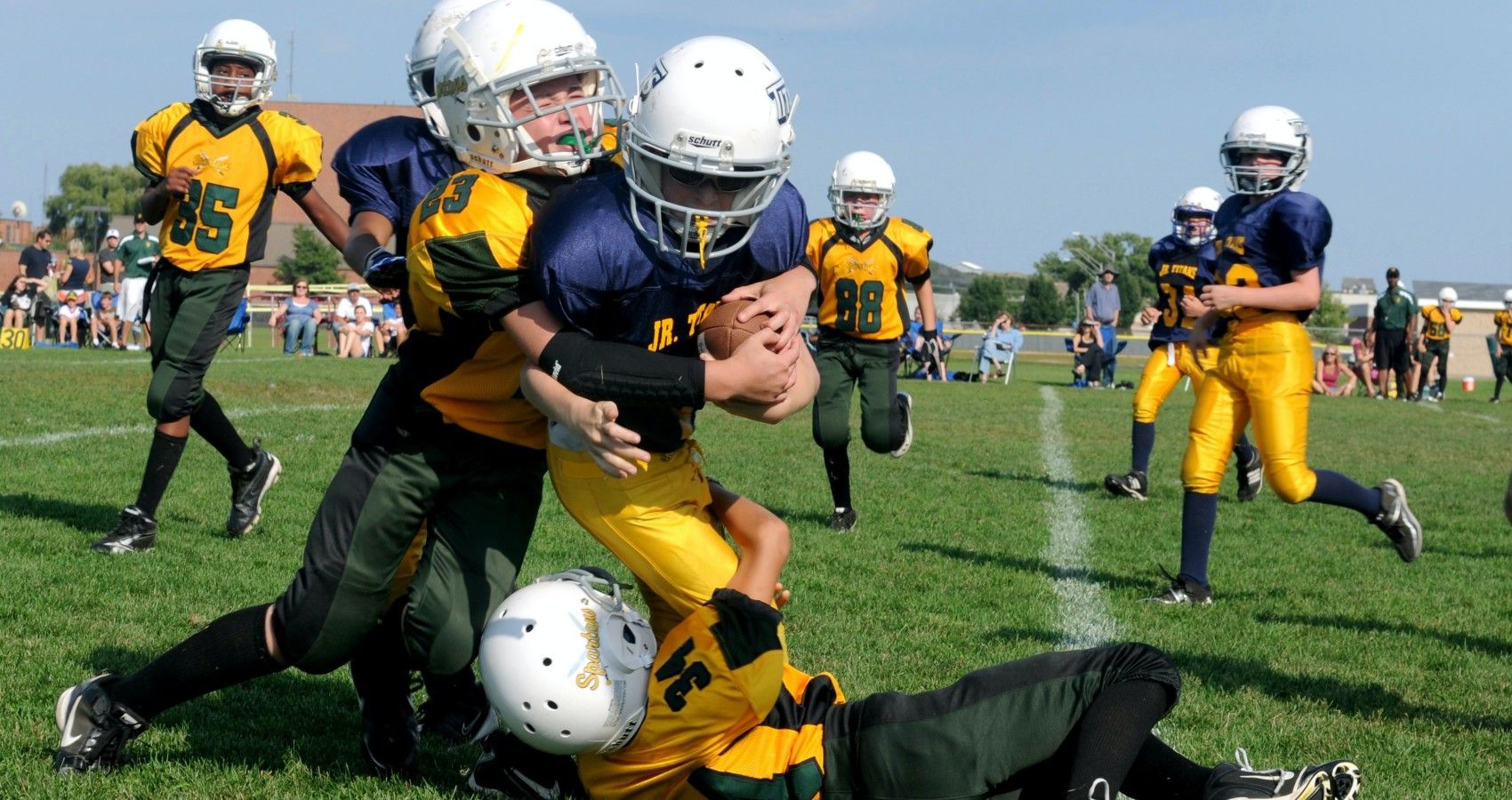 Kids In School Playing Tackle Football