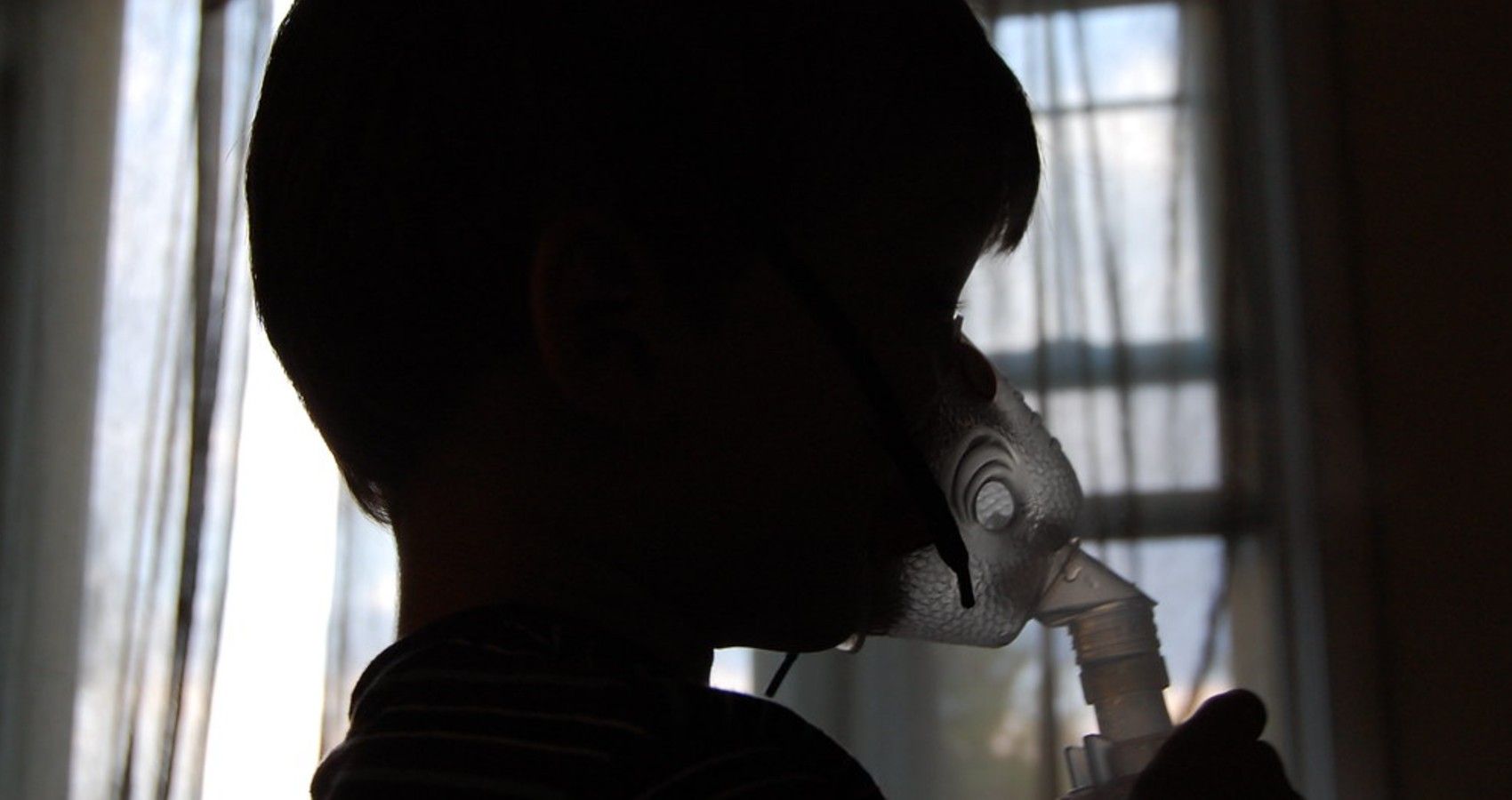 A Child Using An Asthma Inhaler