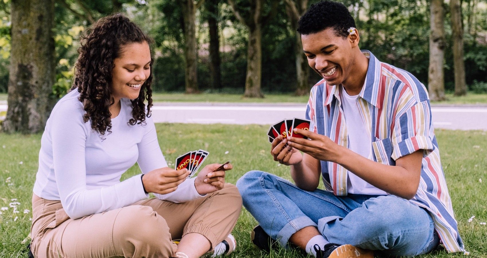 Youth Playing A Card Game Together
