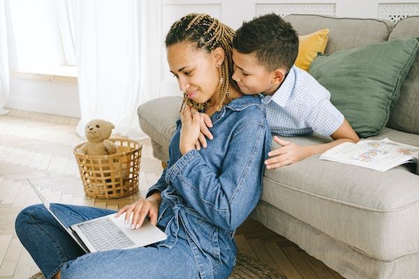 Mom on computer with son
