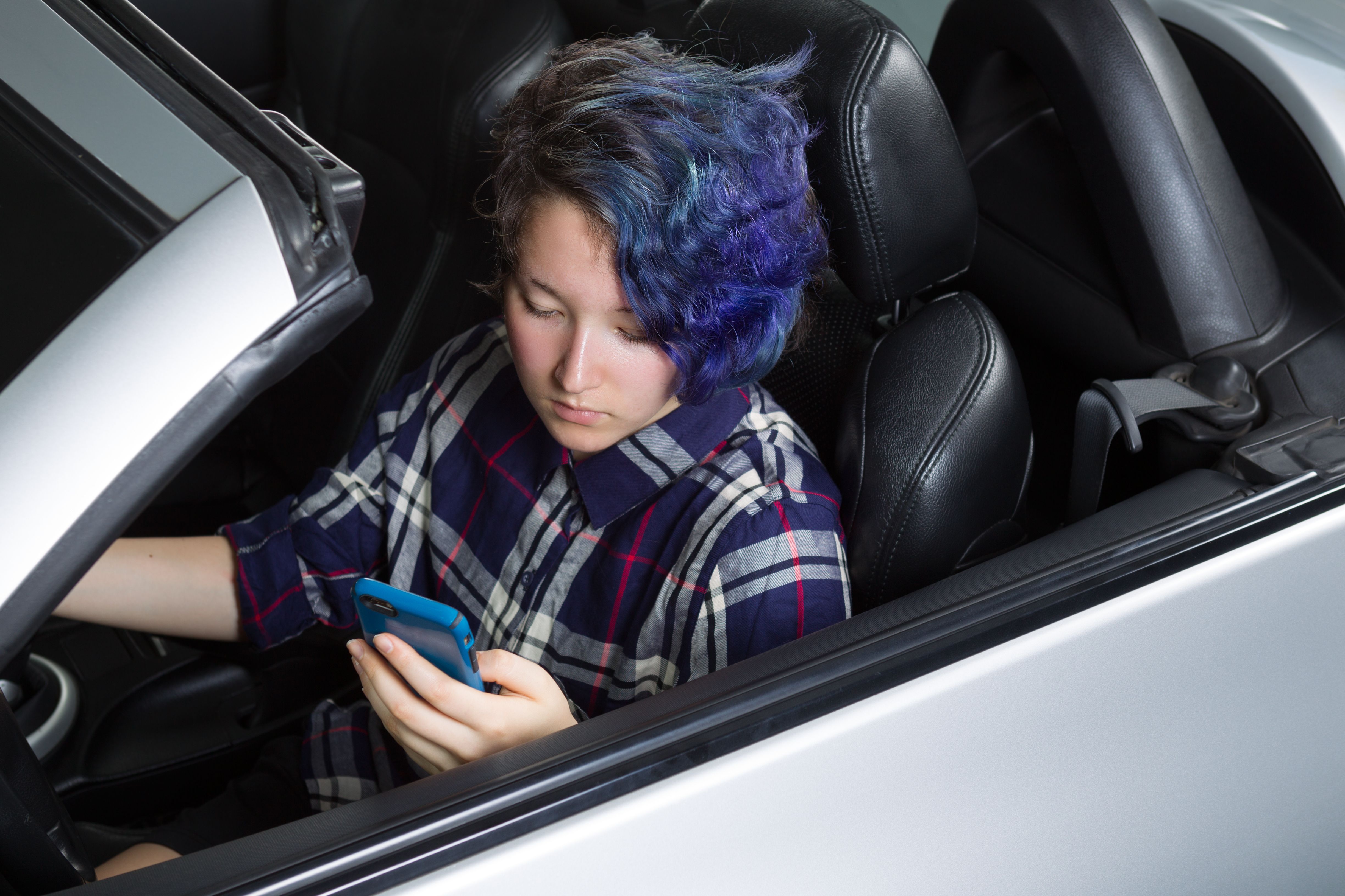 teen on phone while driving